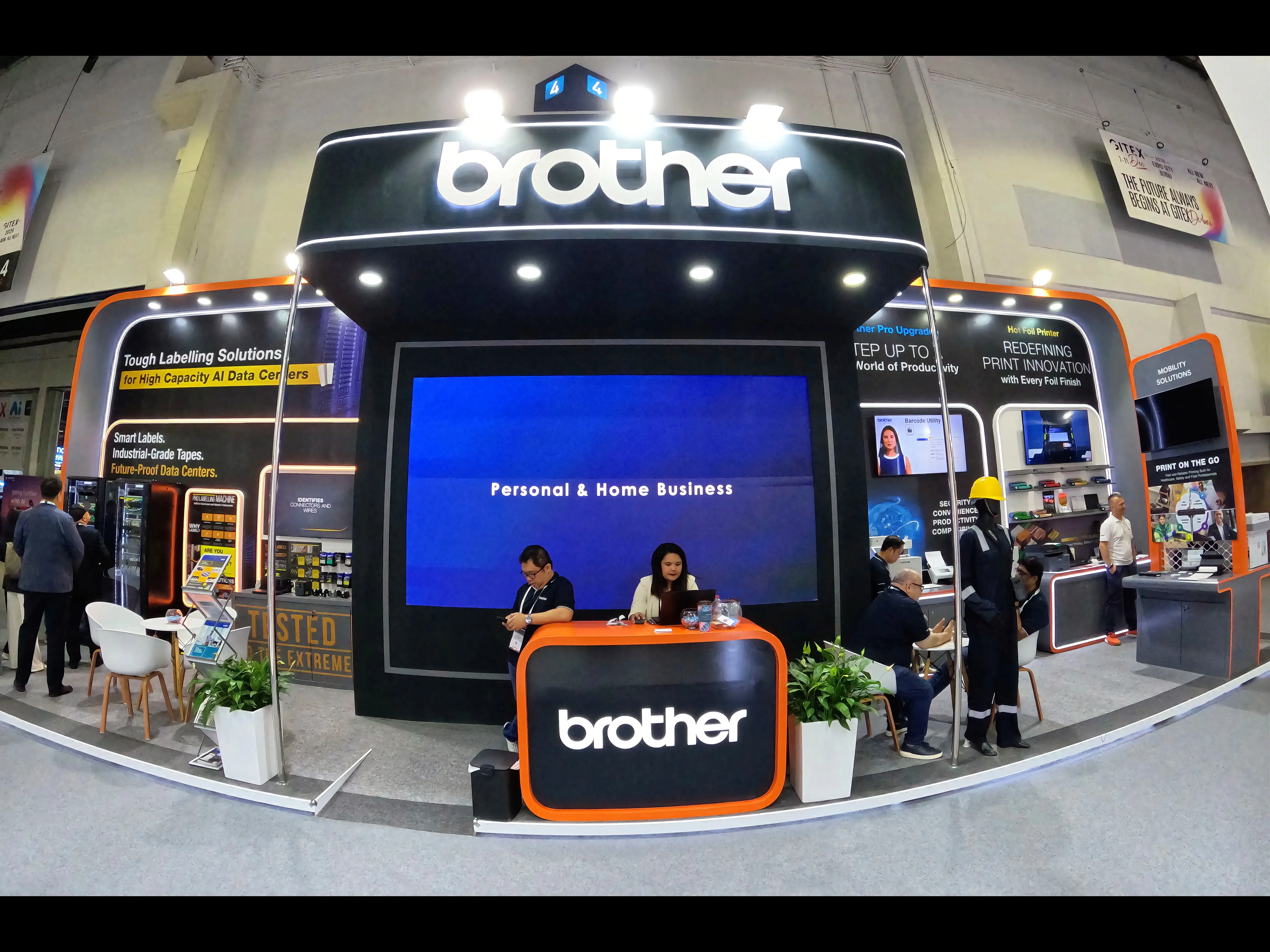 Visitors exploring the Brother exhibition stand