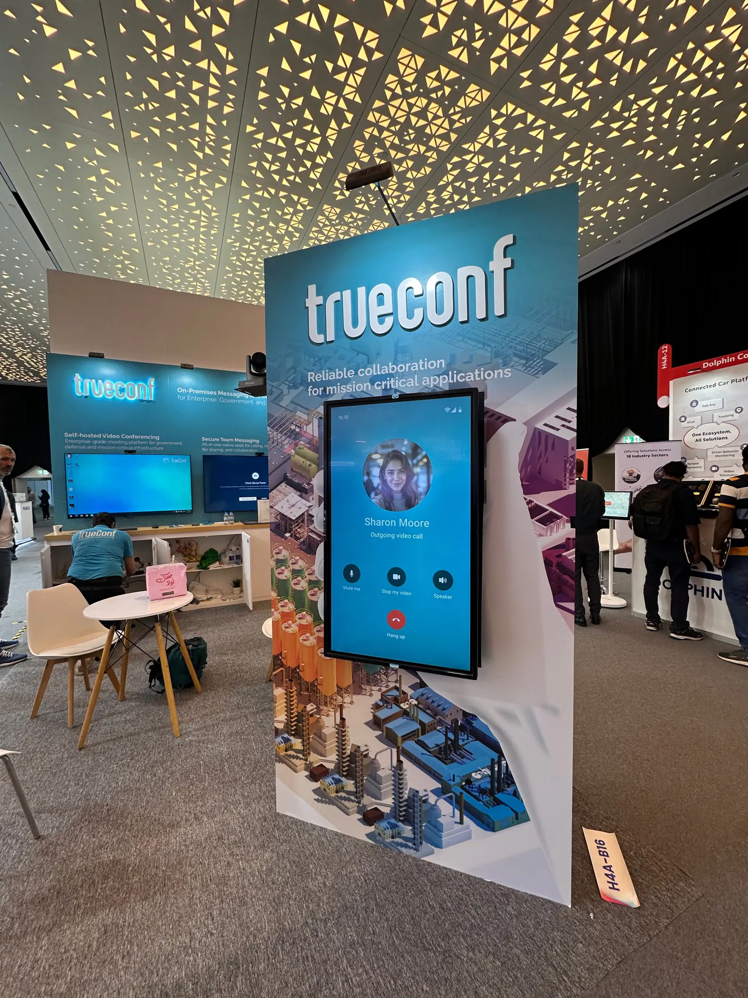 Visitors exploring the TrueConf exhibition stand