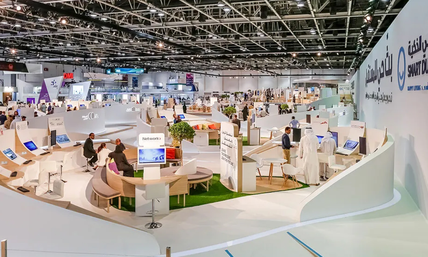 Business professionals discussing solutions at a modern exhibition stand